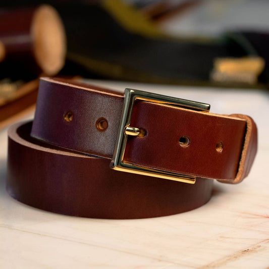 British Brown leather belt with a brass dress buckle.