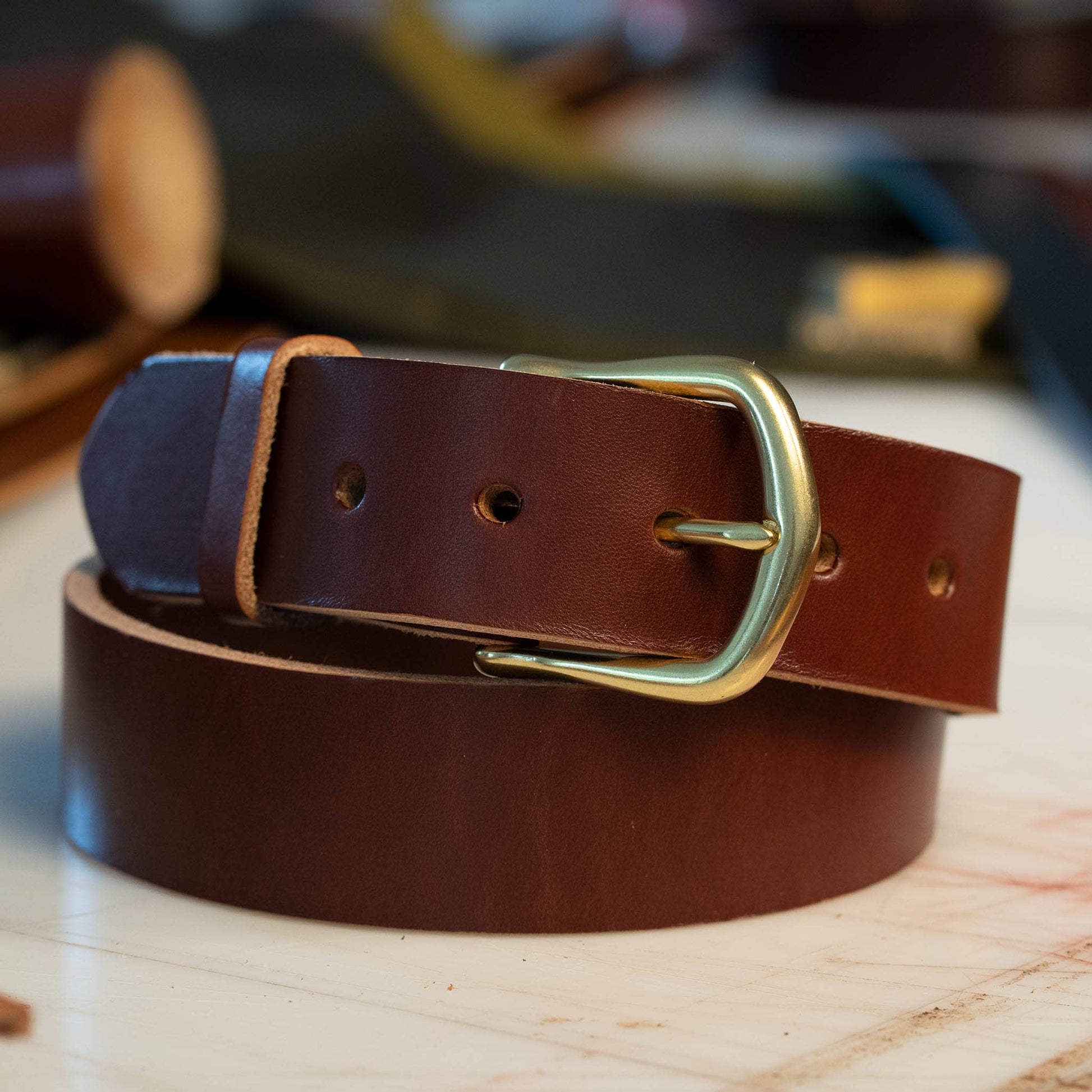 British Brown leather belt with a brass semi dress buckle.