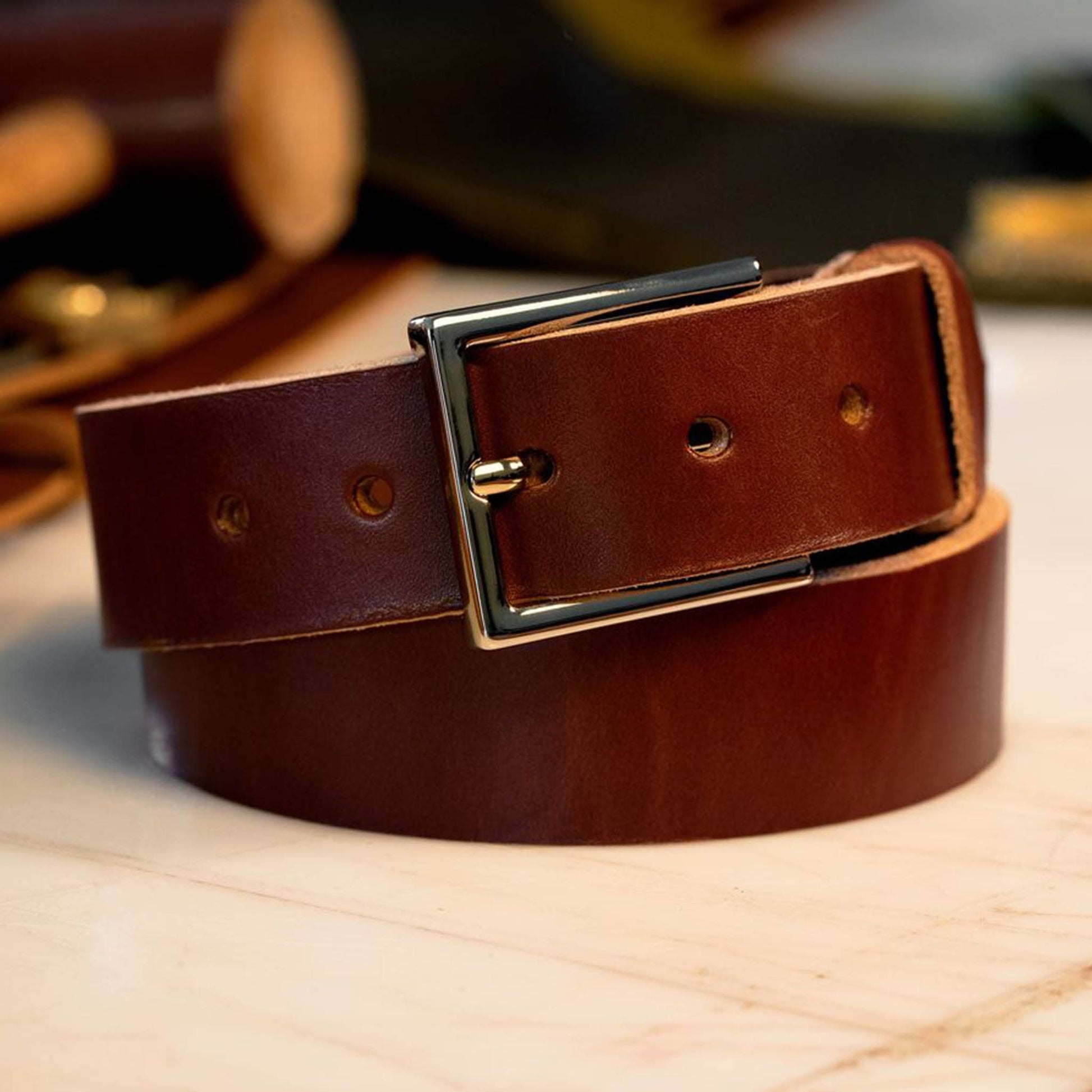 British Brown leather belt with a chrome dress buckle.